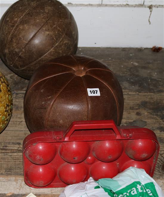 Two leather medicine balls, a discus etc